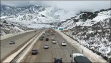  ?? calIFornIa hIghway PaTrol cenTral dIVIsIon VIa aP ?? In this Feb. 18 photo released by the California Highway Patrol Central Division shows traffic open on Interstate I-5 over Grapevine, Calif.