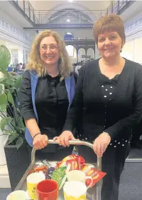  ??  ?? Christine Forrester (left) and Gillian Tomlinson with their tea trolley
