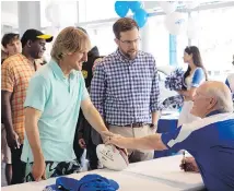  ??  ?? Owen Wilson as Kyle Reynolds, left, Ed Helms as Peter Reynolds and Terry Bradshaw as himself in Father Figures.