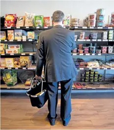  ?? POSTMEDIA FILE PHOTO ?? A customer browses the shelves at Pirate Joe’s store in Vancouver, B.C., on August 21, 2013. The annual pace of inflation increased to 1.3 per cent in July, driven by the higher cost of food and most other categories of consumer items, Statistics...