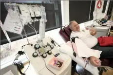  ?? Associated Press ?? Matt Schermerho­rn donates blood at the Impact Life blood center earlier this month in Davenport, Iowa.