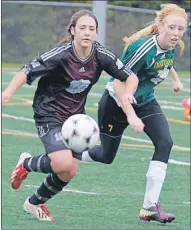  ??  ?? Colonel Gray’s Hailey Fleming, left, and Three Oaks’ Tiffany Cameron chase the ball during Prince Edward Island School Athletic Associatio­n senior girls AAA soccer semifinal action Wednesday in Cornwall.