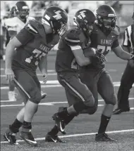  ?? DAVID WITTE/NEW-SENTINEL ?? Liberty Ranch running back Gabe Nino, center, walks into the end zone nearly untouched during Liberty Ranch's victory over Johnson in the season opener at the Hawks' new stadium on Friday.