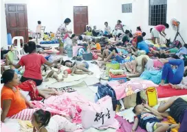  ?? (Reuters) ?? DISPLACED FILIPINOS seeks shelter from Typhoon Mangkhut at an evacuation center in Cagayan, Philippine­s, on Thursday.