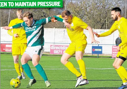  ?? Picture: Andy Jones FM30454579 ?? Ashford United’s Tom O’Connor holds off a Chichester challenge at Homelands on Saturday