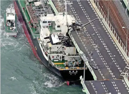  ??  ?? A 2500-ton tanker crashed into the bridge connecting the Kansai Internatio­nal Airport to the mainland during the height of Typhoon Jebi, leaving about 5000 people stranded at the airport.