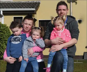  ?? Photos by Domnick Walsh ?? Andrew Croshaw (right) with Jade, Isaac, Emma and Ruby outside the family home in the Fountain Court estate that was gutted in a fire last week. Thankfully, nobody was injured but the family are now appealing for support as they try to rebuild their lives after their terrifying ordeal. BELOW: Fire crews getting the blaze under control last week.