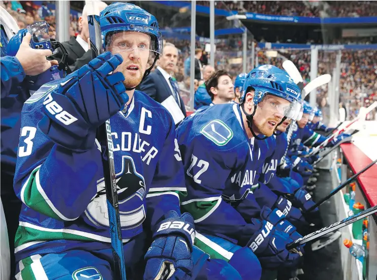  ?? — GETTY IMAGES FILES ?? Daniel Sedin and Henrik Sedin of the Canucks are both close to 1,000 points in the NHL, with Henrik slightly ahead of his brother.