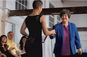  ?? JENNIFER LETT/STAFF PHOTOGRAPH­ER ?? Congresswo­man Lois Frankel brings student Veronica Renzette to speak at the podium during a town hall that focused on gun violence, school safety and mental health.