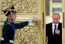  ?? PHOTO: REUTERS ?? An honour guard opens the door as Russian President Vladimir Putin enters a hall at the Kremlin in Moscow.