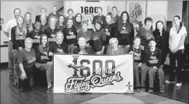  ??  ?? WAYLAND BAPTIST players from the 1950s, ’60s and ’70s gathered with the current Flying Queens to celebrate the program’s 1,600th win in November.