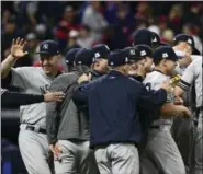  ?? DAVID DERMER - THE ASSOCIATED PRESS ?? New York Yankees celebrate after the Yankees defeated the Cleveland Indians 5-2 in Game 5 of s baseball American League Division Series, Wednesday, Oct. 11, 2017, in Cleveland, to advance to the ALCS.