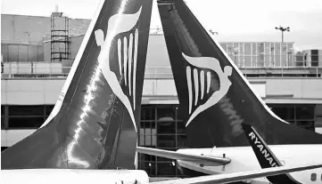  ??  ?? Ryanair planes at Dublin Airport on Nov 25, 2016. — WP-Bloomberg photo