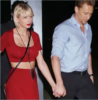  ??  ?? Hand in hand: Taylor Swift and Tom Hiddleston in Nashville last night