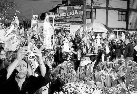  ??  ?? Saint Death believers pray during the celebratio­n of Saint Death in the popular Tepito neighbourh­ood of Mexico City.