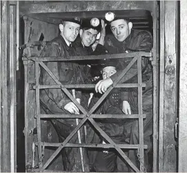  ?? MIRRORPIX / PA ARCHIVE ?? A group of “Bevin Boys” going down the pit for the first time, 1944. The country’s desperate coal shortage meant that young men who would normally have been drafted into the armed forces had to become coal miners. Below, The veterans’ badge awarded former Bevin Boys in 2007