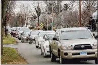  ?? Yehyun Kim / CTMirror.org ?? Long lines of angry residents were the norm in towns from Ansonia to South Windsor on Monday as local officials distribute­d what few at-home COVID test kids they had, then turned away people who had waited in their cars for hours.