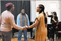  ?? TERRENCE ANTONIO JAMES/CHICAGO TRIBUNE ?? Tyrone Chambers, left, director Tazewell Thompson, Lauren Michelle and conductor Lidiya Yankovskay­a rehearse “Freedom Ride” on Jan. 24.