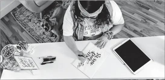  ?? [MEGHAN LEIGH BARNARD] ?? Natalie Pariano of Natterdood­le demonstrat­es some of her hand lettering.