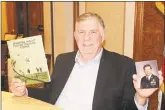  ?? Robert Koch / Hearst Connecticu­t Media ?? Air Force Lt. Col. Howard W. Dixon holds the curriculum catalog for the Advanced Airlift Tactics Technical Center, which he founded, and his service photo.