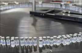  ?? PFIZER ?? Vials of Pfizer’s updated COVID-19vaccine during production in Kalamazoo, Mich.