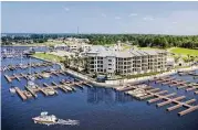  ??  ?? The Shoreline is a 56-unit condominiu­m on Lake Conroe featuring eight floor plans. All residences have waterfront views of Lake Conroe.