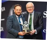  ?? ?? Honoured: Al-Samarrai (left) receives the top award from SJA president and former Mail on Sunday chief sportswrit­er Patrick Collins