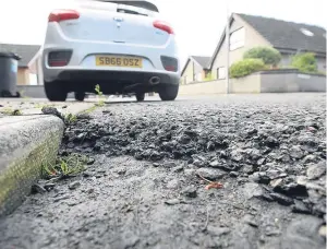  ??  ?? Potholes can be the bane of motorists’ lives. Picture: Kris Miller.