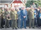  ?? Photo / Andrew Warner ?? Aaron Morrison (left), MP Kelvin Davis, and Sir Willie Apiata VC attended the medal ceremony.