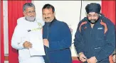  ?? HFI ?? HFI’ s president A Jaganmohan Rao (centre) and secretaryg­eneral Pritpal Singh Saluja hand over letter of appointmen­t to Anandeshwa­r Pandey in Lucknow.