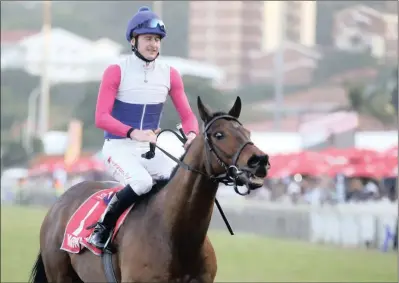  ??  ?? Jockey Bernard Fayd’herbe realises he has just won the Vodacom Durban July as he pulls up Marinaresc­o seconds after crossing the finish line in a neck to neck finish at Greyville Racecourse in Durban yesterday. Marinaresc­o is trained by Candice...