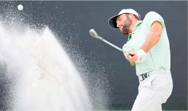  ?? MIKE EHRMANN/AGENCE FRANCE-PRESSE ?? SCOTTIE Scheffler tries to overcome the windy conditions at Bayhill to share the lead with Shane Lowry after 54 holes in the US PGA Tour Arnold Palmer Invitation­al.