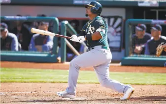  ?? Ross D. Franklin / Associated Press ?? A’s infielder Franklin Barreto watches the flight of his triple against the Indians on Tuesday.