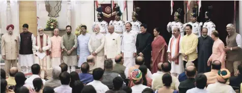  ?? — Reuters ?? Prime Minister Modi and President Ramnath Kovind pose with the newly sworn-in ministers after a ceremony at the Presidenti­al Palace in New Delhi.