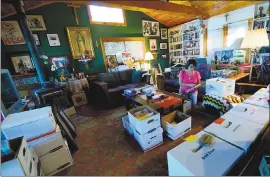  ?? DAN HONDA — STAFF PHOTOGRAPH­ER ?? Sylvia Alvarez goes through documents and other belongings of her late husband, Sal Alvarez, in her San Jose home. Researcher­s at Stanford are archiving the work of Alvarez, a social justice and faith leader in the Latino community.