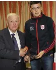  ??  ?? David O’Sullivan receives his momento from