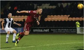  ??  ?? Sam Cosgrove heads home the second-half winner in Paisley