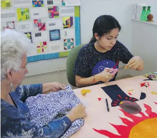  ?? PHOTOS: SOCIAL JUSTICE SEWING ACADEMY ?? Yesenia Madrid, right, creates a social justice quilt with the help of a Social Justice Sewing Academy volunteer in Richmond, Calif.