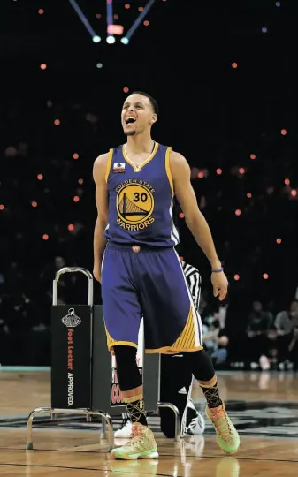  ?? Elsa / Getty Images ?? Stephen Curry lets out a scream during his Three-Point Contest victory. Curry hit 20 of 25 shots in the finals for a record 27 points, defeating Klay Thompson and Kyrie Irving.