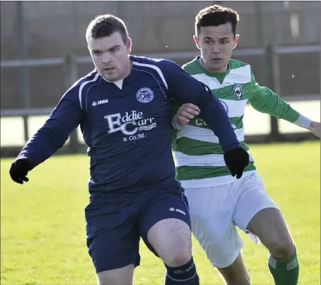  ?? Pic: Carl Brennan. ?? Paul Logan of Calry Bohs in action with Bradley Lyttle of Strand Celtic in Strandhill on Sunday.