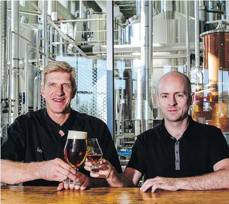  ??  ?? Central City’s brewmaster Gary Lohin, left, and head distiller Stuart McKinnon have released their single-malt whisky Lohin McKinnon in time for Robbie Burns Day on Wednesday. The malt drink is not called a scotch, “but it is full of scotch techique,”...