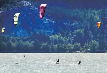  ?? NICK PROCAYLO ?? Kite surfers ride the waves in Squamish Spit. The area is known for its recreation­al opportunit­ies.