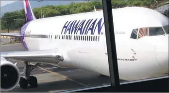  ?? FRANCIS DEAN / GETTY IMAGES ?? Hawaiian airlines aeroplane parked at gate in Hawaiian Capital Honoluu Interntion­al Airport in 2015.