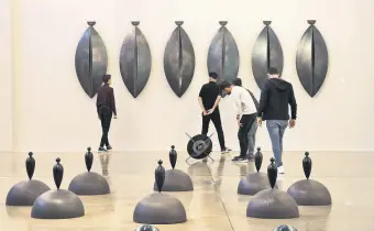  ?? ?? Visitors examine artwork on display at the Baksı Museum in Bayburt, northern Turkey, May 24, 2022.