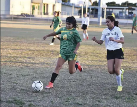  ?? PHOTO AARON BODUS ?? Holtville’s Jazmine Velasquez (8) rears back to clear the ball in the first half of Saturday’s Division V quarterfin­al game against West Shores.