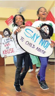  ?? CONTRIBUTE­D PHOTOS ?? Children from various schools march during the Scotiabank National Children’s Day Kiddy Parade that was interrupte­d by rain but took an alternativ­e format inside the Sts Peter and Paul auditorium in St Andrew.