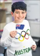  ??  ?? Representi­ng Australia: Year 6 student Jharhyss Scott flying the flag as part of team Australia.