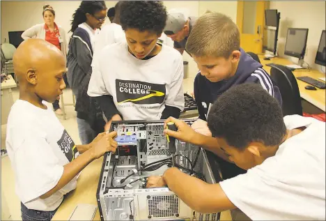  ?? SUBMITTED PHOTOS ?? Alijah Jennings, left, Mark Brown, Jacob Keating and Chris Turner work on building a computer during Destinatio­n Imaginatio­n at the College of Southern Maryland. The J.P. Ryon Elementary School fifth graders were introduced to college programs during...