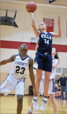  ?? PETE BANNAN — DIGITAL FIRST MEDIA ?? VIlla Maria’s Paige Lauder makes a basket in the third quarter of the Hurricanes’ 69-58 victory over Rustin in District semifinals at Harriton