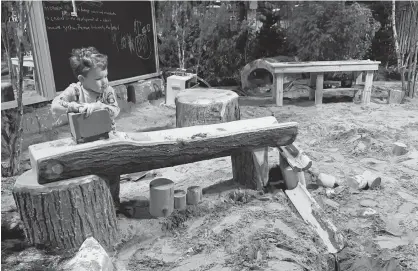  ?? CONTRIBUTE­D PHOTO ?? This week, the Cullen brothers explore the important role nature will play in the future. One of Mark's grandchild­ren play in a plays space with sand and water last Saturday. The red oak slide was a hit, the sand pit and chalk boards, the playhouses as well, but nothing quite stopped the kids in their tracks quite like the water works.